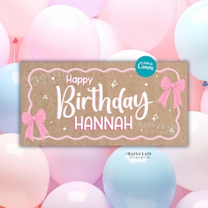 May include: A rectangular sign with the words "Happy Birthday HANNAH" in white script, framed by a pink border and bows. The sign is set against a backdrop of pastel pink, blue, and white balloons.