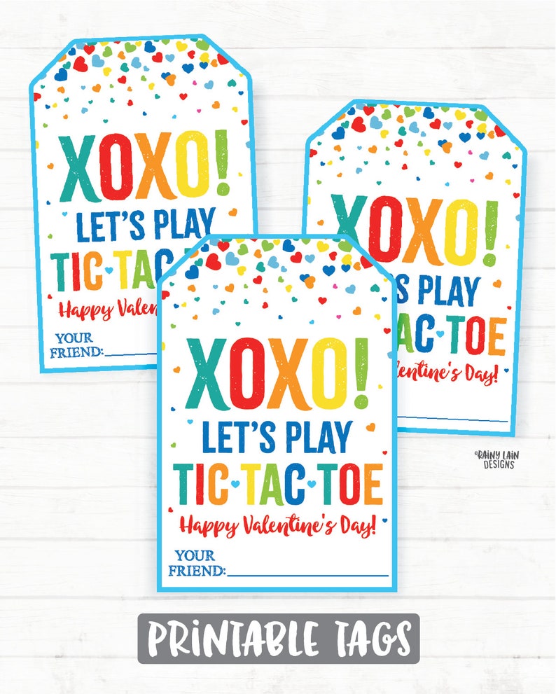 May include: Three printable Valentine's Day gift tags with a blue border and a confetti background. The tags feature the text "XOXO! Let's play Tic-Tac-Toe. Happy Valentine's Day!" with a space for the giver's name.