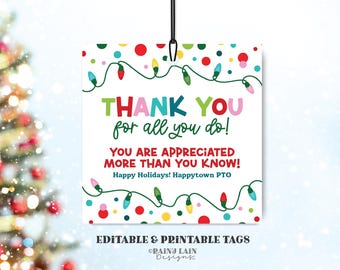 May include: Printable Christmas gift tag with a colorful string of lights design. The tag says "Thank you for all you do! You are appreciated more than you know! Happy Holidays! Happytown PTO".