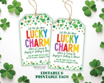 May include: Two green, white, and gold printable tags with shamrock designs. The text on the tags reads "Let Me Be Your Lucky Charm When it Comes to Buying or Selling a Home! Call Me Today! 555-123-4567 Hannah Sampson, Happistar Realty".