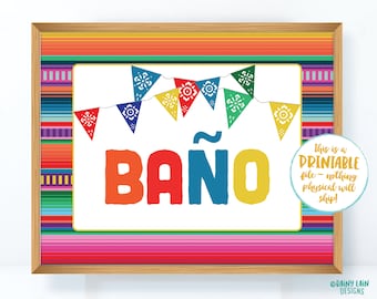 May include: A printable sign with a colorful Mexican-style border and a white background. The sign says "Baño" with a tilde over the "n" and has a string of colorful flags above the word. The text "This is a Printable file - nothing physical will ship!" is in the bottom right corner.