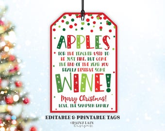 May include: Red and green Christmas gift tag with white polka dots. The tag says "Apples for the teacher used to be just fine, but come the end of the year you really deserve some wine! Merry Christmas! Love, The Sampson Family."
