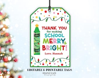 May include: Printable gift tag with a colorful crayon illustration and the text "Thank you for making school merry & bright! Love, Hannah". The tag is decorated with colorful dots and lights.