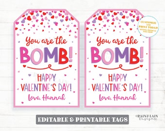 Puede incluir: Dos etiquetas de regalo imprimibles para el Día de San Valentín, de color rosa y blanco, con un fondo de confeti. Las etiquetas muestran el texto "You are the BOMB! Happy Valentine's Day! Love, Hannah".