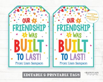 May include: Two printable gift tags with a rainbow heart confetti background. The text on the tags reads "Our #Friendship #Was Built To Last!" with the name "Liam Sampson" at the bottom. The tags are editable and printable.