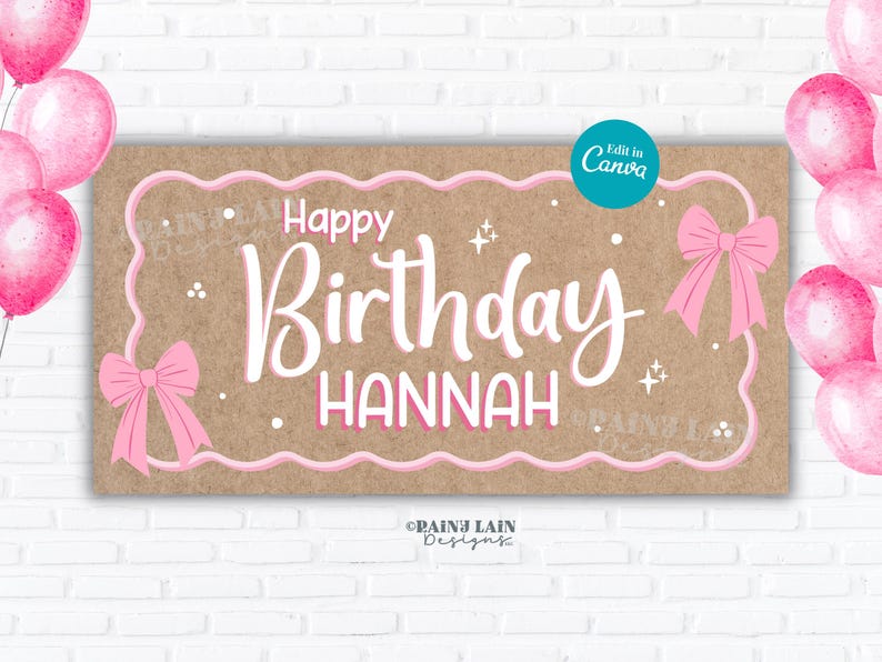 May include: A rectangular banner with a brown background and pink accents. The banner reads "Happy Birthday Hannah" in white script. Pink bows and stars decorate the banner. Pink balloons are in the background.