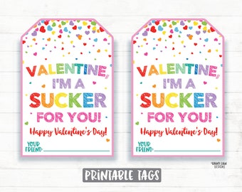 May include: Two printable Valentine's Day gift tags with a rainbow design. The tags feature the text "Valentine, I'm a sucker for you!" and "Happy Valentine's Day!" with space to write "Your Friend:"