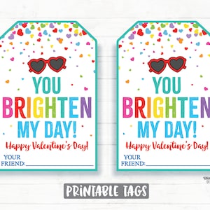 May include: Two printable Valentine's Day gift tags with a rainbow heart confetti background. The tags feature a pair of sunglasses and the text "You brighten my day! Happy Valentine's Day! Your friend:"