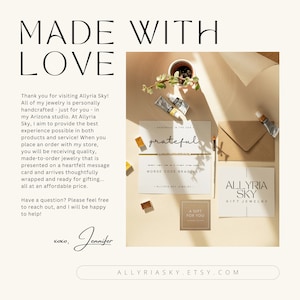 May include: A close-up of a card with the text "grateful" written in cursive. The card is surrounded by paint tubes and a brown envelope. The text "ALLYRIA SKY GIFT JEWELRY" is on a separate card.