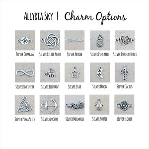 May include: A grid of 15 silver charms, each representing a different design. The charms are arranged in three rows of five. The charms include a compass, celtic knot, arrow, pineapple, infinity symbol, elephant, star, moon, cactus, pizza slice, anchor, mermaid, turtle, and flower.