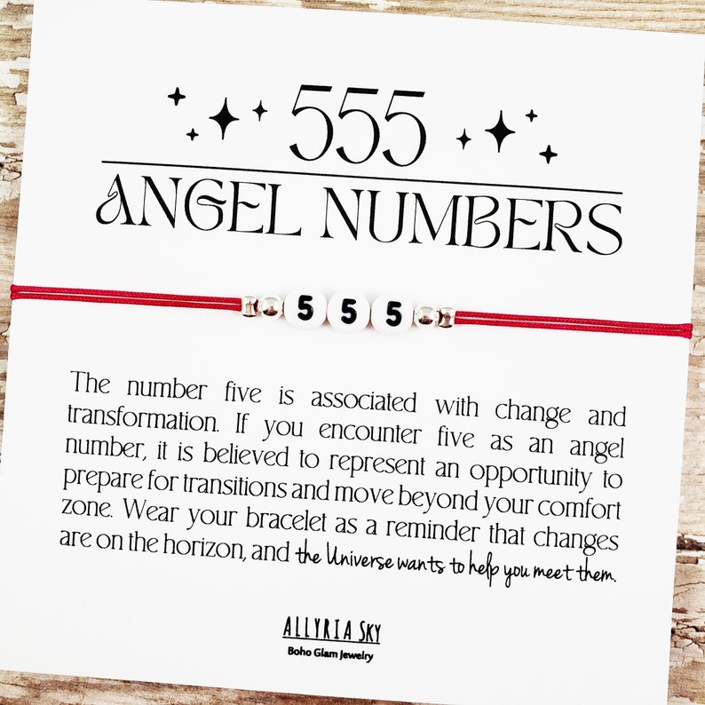 May include: Red string bracelet with white beads that spell out "555". The bracelet is accompanied by a white card with the text "+++ 555 +++ ANGEL NUMBERS" and a description of the meaning of the angel number 555.