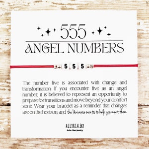 May include: Red string bracelet with white beads that spell out "555" and a card with the text "Angel Numbers" and a message about the meaning of the number five.