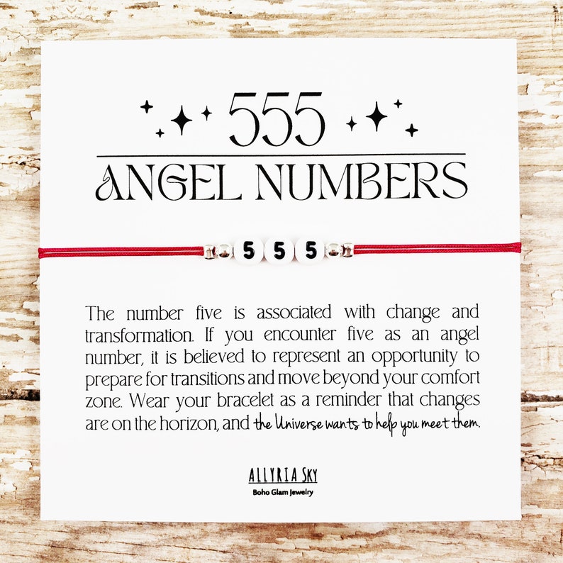 May include: Red string bracelet with white beads that spell out "555" and a card with the text "Angel Numbers" and a message about the meaning of the number five.
