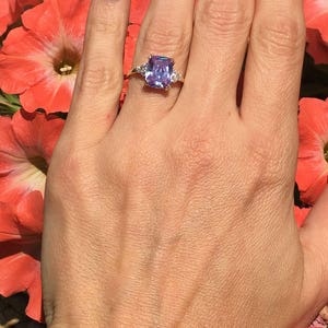An absolute stunner, classic lavender amethyst engagement ring with an octagon cut gemstone of your choice as it’s centre stone and with round cut clear quartz on the band to further accentuate it.