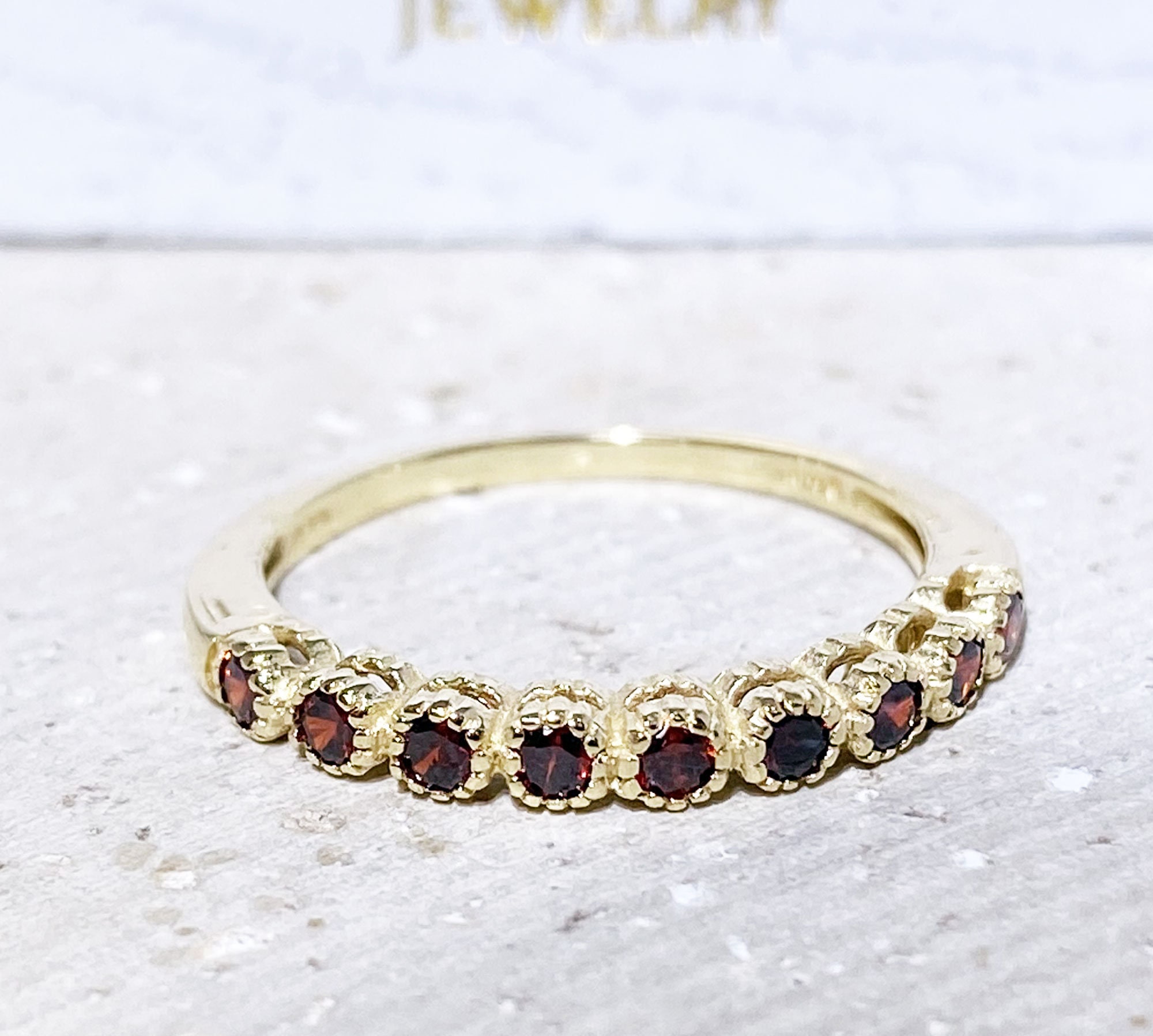 Garnet eternity 2024 ring yellow gold