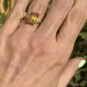 An absolute stunner, classic natural citrine engagement ring with an octagon gemstone of your choice as it’s centre stone and with round cut clear quartz on the band to further accentuate it.