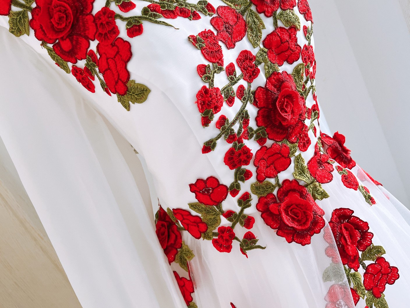 long white dress with red roses White Rose Fields Gown Teuta Matoshi