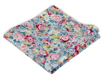 May include: A folded pocket square with a floral pattern in shades of pink, blue, and white.