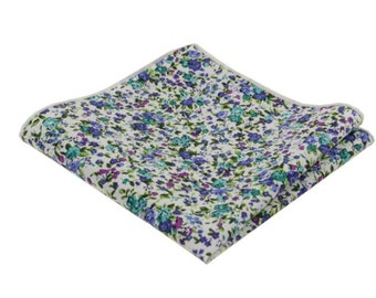 May include: A white pocket square with a floral pattern in shades of blue, green, and purple.