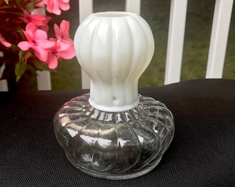 May include: A white milk glass lamp finial with a clear glass base with a ribbed design.
