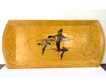 May include: A rectangular wooden serving tray with rounded corners. The tray features a painted scene of three ducks in flight against a cloudy sky. The tray has a light wood grain finish.