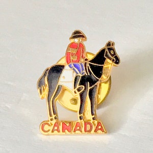 Collectible TRAVEL Hat / Lapel Pin CANADA  Souvenir Pin Canadian Mountie Pinback