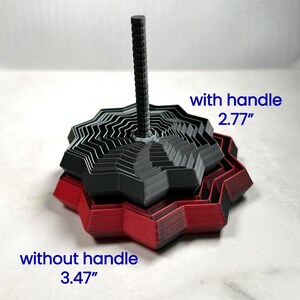 Two 3D printed star fidgets in matte red and black shown stacked together. One version includes a handle (2.77 in high) and one without (3.47 in). Blue text labels each. Displayed on a light marble background.