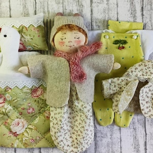 Doll with clothes, baby doll, gift set in a suitcase, doll with a toy.