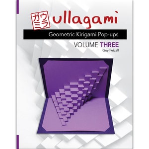 May include: A book cover with the title "ullagami Geometric Kirigami Pop-ups Volume THREE" by Guy Petzall. The cover features a purple pop-up card with a geometric design.