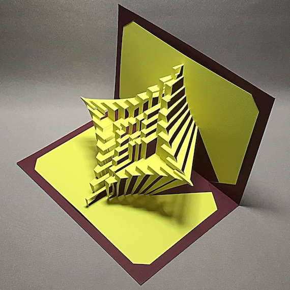 Une Sculpture En Papier 3d Avec Un Motif En Spirale Qui Dit au