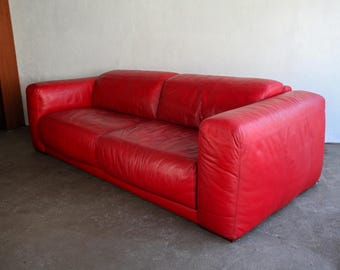 Vintage 1980s postmodern three seater sofa in red leather upholstery