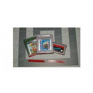 May include: A collection of Game Boy cartridges, including "Mystical Ninja Starring Goemon" and "Ice Climber." The cartridges are in their original plastic cases, with colorful labels. The background is a gray and white grid.