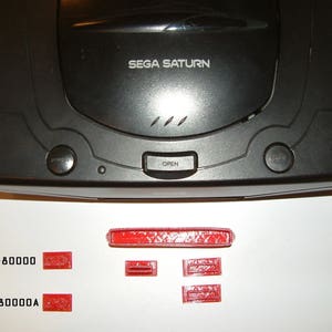 6 piece set of Sega Saturn port & switch dust covers Designed and Made in the USA.