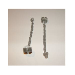 May include: Two gray plastic chains with a loop at each end. The chains are about 10 inches long.
