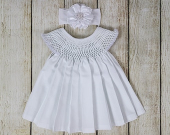 baby girl in white frock