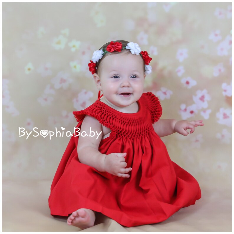 red newborn gown