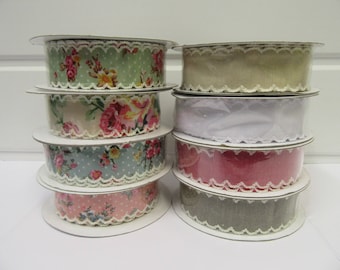 May include: Eight spools of ribbon with various floral patterns and lace trim. The ribbons are in shades of pink, green, blue, white, and beige.