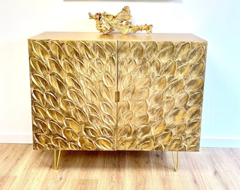 Gold cabinet with leafy texture and gold hairpin legs