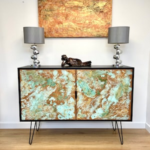 Bar cabinet with hairpin legs and copper patina texture