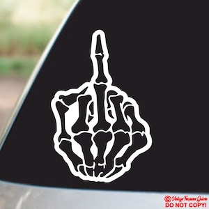 May include: A white skeleton hand giving the middle finger. The hand is stylised and detailed, with visible bones and joints. The background is black.