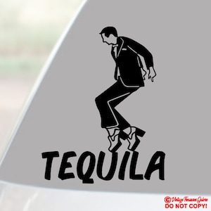 May include: Black and white graphic of a person in a suit dancing, with the word "TEQUILA" in bold letters below. The image is a sticker or decal, likely for a car or window.