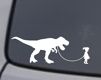 Flicka som går med en Tyrannosaurus Rex - Vinyldekalklistermärke Bil Lastbil Skåpbil SUV Båt Laptop Fönster Vägg Stötfångare Bakruta Bakruta Jdm Rolig T-Rex