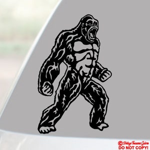 May include: Black and white illustration of a large, angry gorilla with its mouth open, showing its teeth. The gorilla is walking forward with its arms raised.