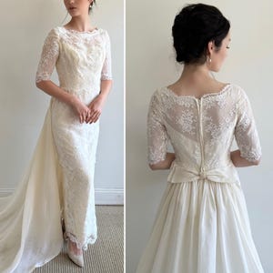 A Vintage 1950s Ivory Short Sleeve Chantilly Lace Wedding Gown with Tiered Skirt and Sheer Organza Train Panel