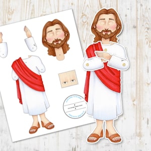 May include: Printable paper doll of Jesus wearing a white robe and red sash. The doll has a beard and long brown hair. The doll is made up of separate pieces that can be cut out and assembled.