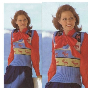 May include: A blue and white knitted vest with a red reindeer pattern. The vest has a red bow tie and is worn over a red long-sleeved shirt.