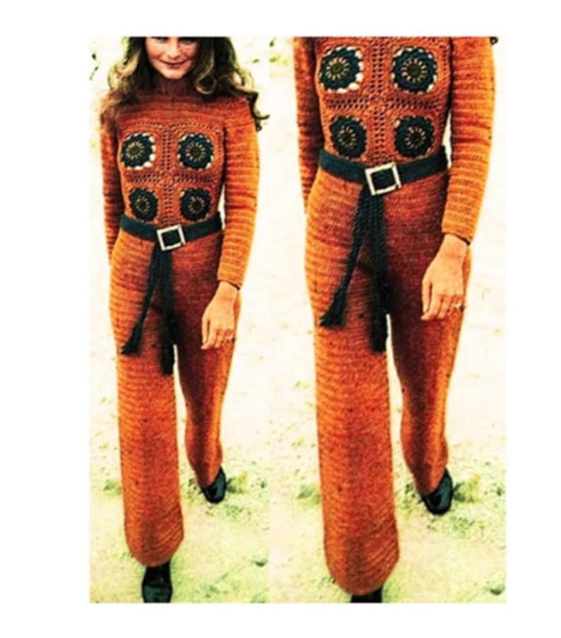 May include: A crocheted jumpsuit in a burnt orange color with a black belt and tassel. The jumpsuit features a geometric pattern with crocheted flowers.