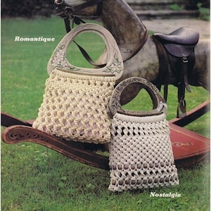 May include: Two crocheted bags with wooden handles. The bag on the left has a floral design on the handle and is labelled "Romantique". The bag on the right has a plain wooden handle and is labelled "Nostalgia".