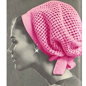 May include: A pink crocheted hairnet with a large mesh pattern. The hairnet is tied at the back of the head.