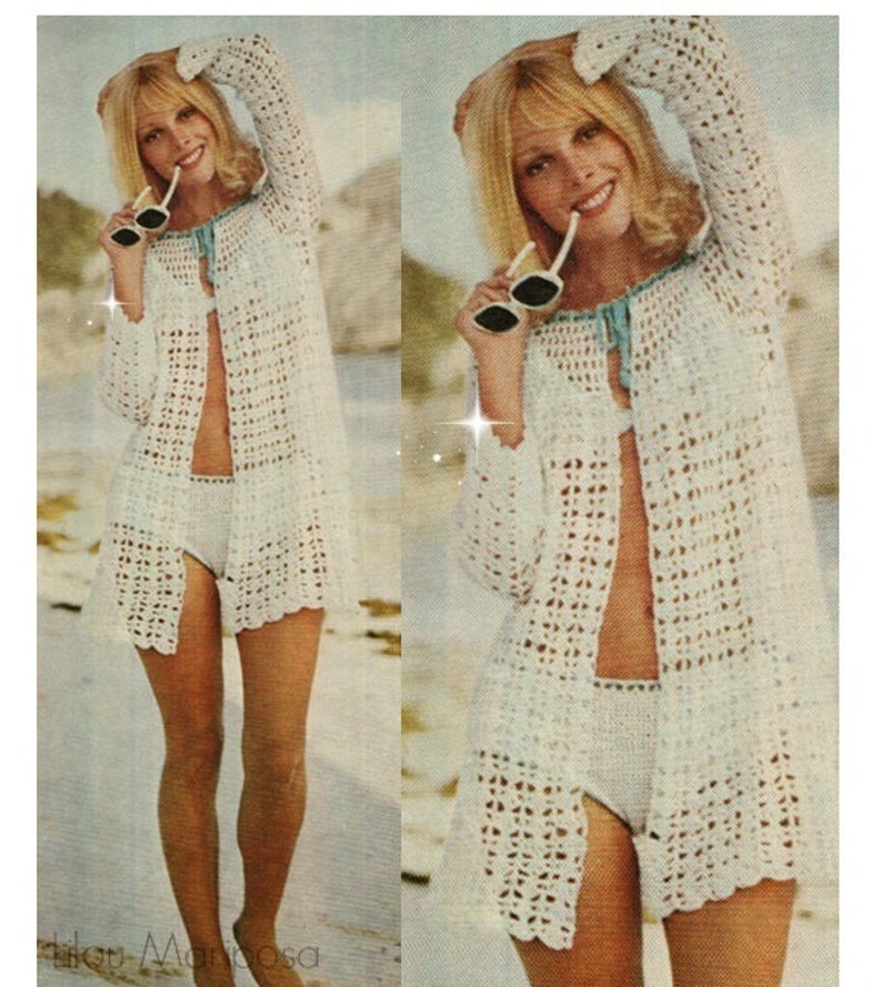 May include: A white crochet beach cover-up with long sleeves and a tie at the neck. The cover-up is open at the front and has a crocheted pattern.